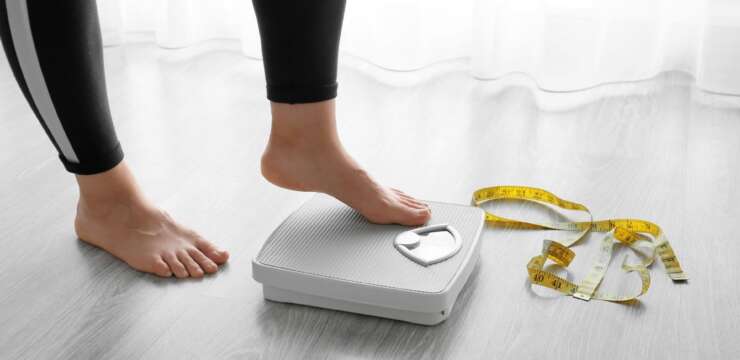 woman getting on the scale