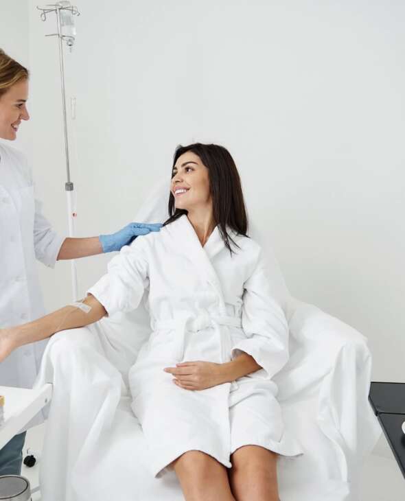woman getting an IV in a wellness spa