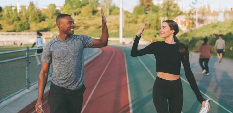Two athletes high-fiving